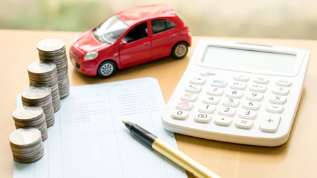 Editorial toy car coins calculator gettyimages 637692094 photobuay