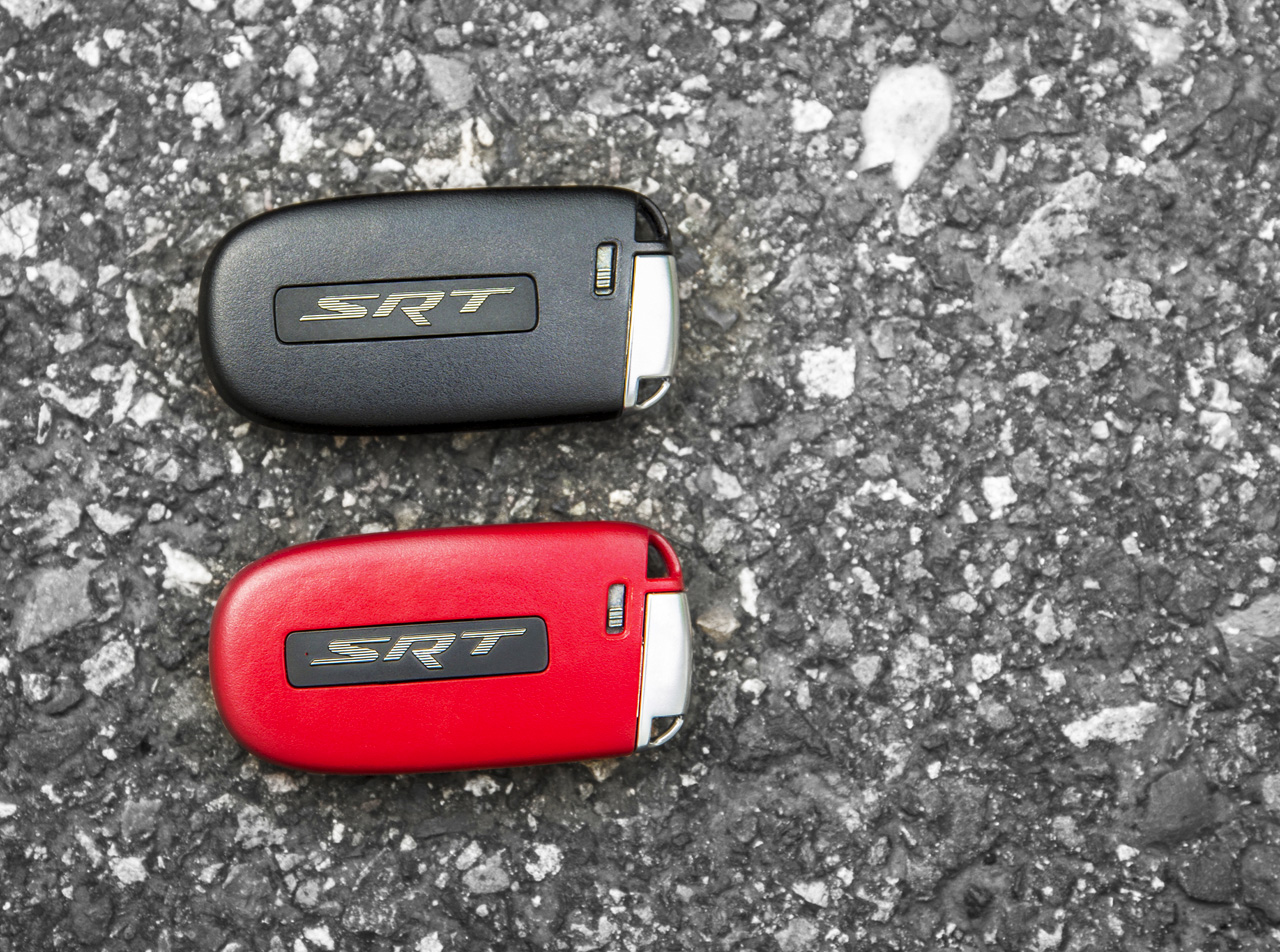 Two paths diverge in the woods with the 2015 Dodge Charger SRT Hellcat, but fortunately you can choose to take both. If you elect to leave the house with the black key in your pocket the Hellcat will be limited to 500 horsepower, and it will also lock you out of first gear on launch. There's an additional restriction of just 4,000 rpm in any gear while using this less hardcore key with the sedan. The red key is the all-out, 707 Hellcat horsepower buffet, but to us it seems more than a little weird to assume that someone who couldn't handle 707 horses would be comfortable with 500.