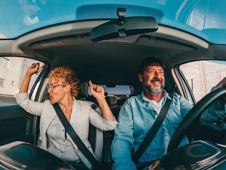 Happy couple in the car
