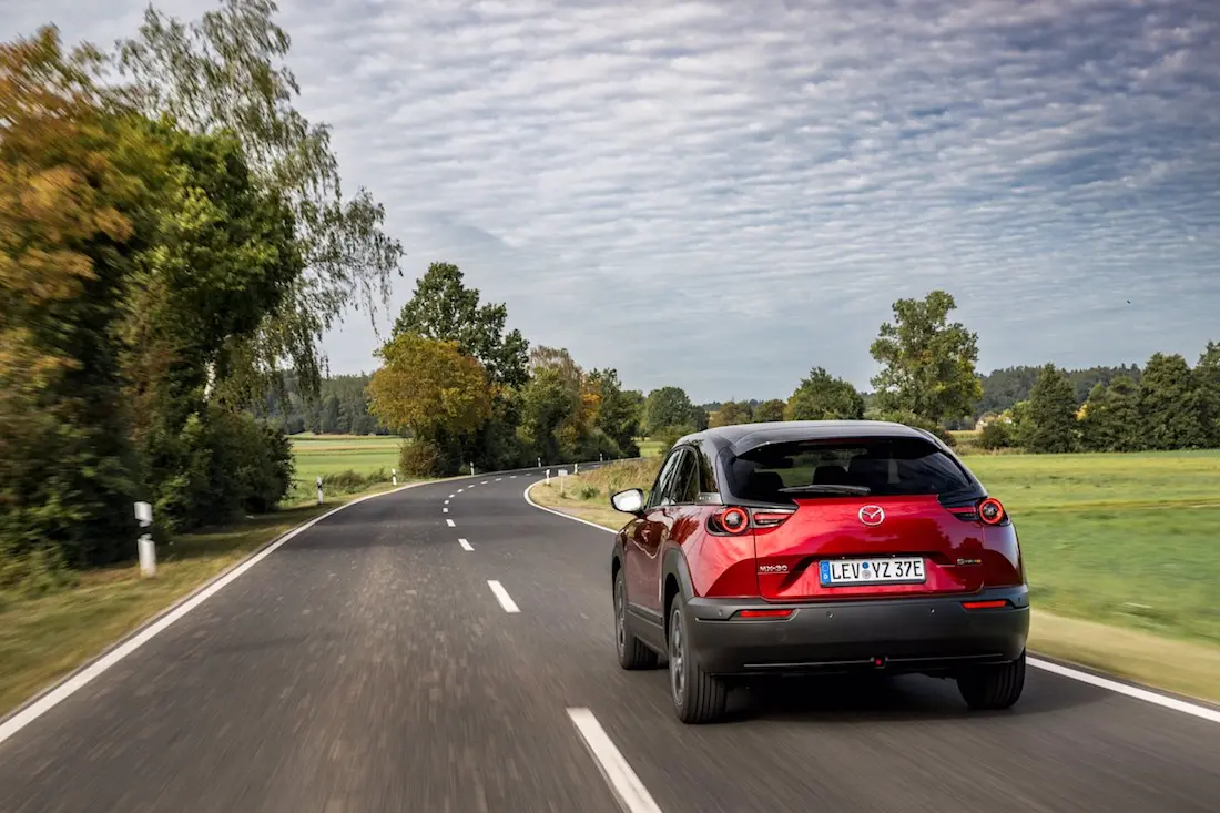 Mazda MX-30 R-EV (2023) dynamic, rear view Mazda MX-30 R-EV (2023) dynamic, rear view