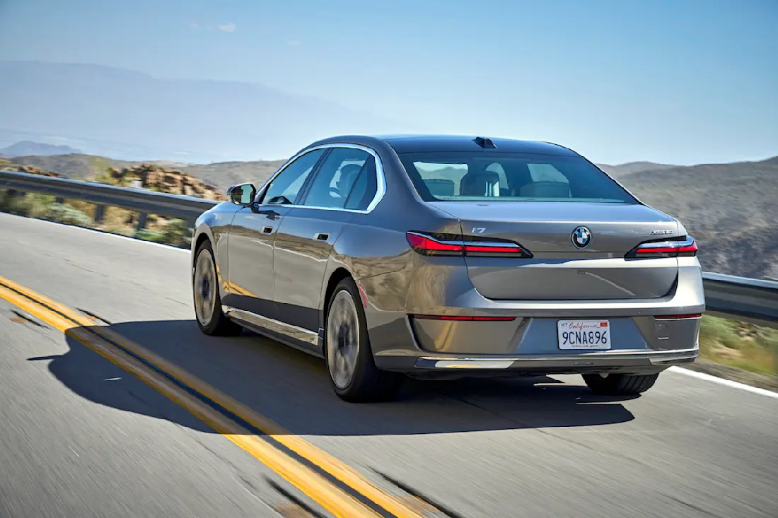 BMW i7 (2023) driving, rear view