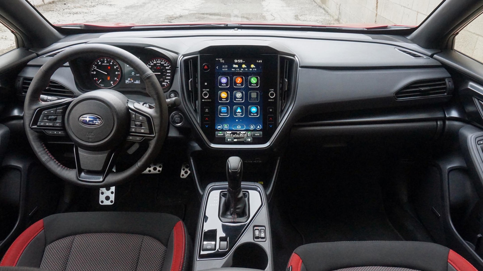 A close-up of Subaru Impreza's interior featuring the dashboard and steering wheel, emphasizing the layout and functionality