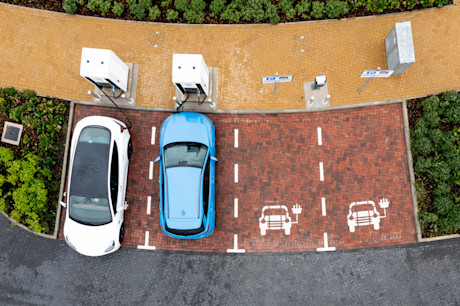 Two electric cars parking at charging station