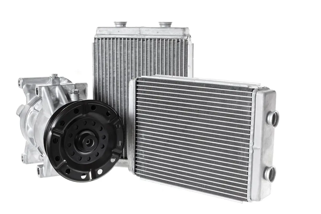 Engine cooling radiators and automotive air conditioning compressor