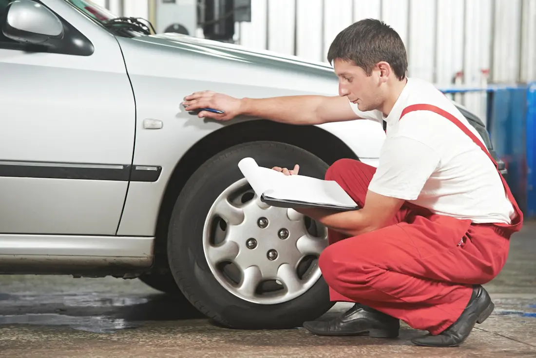 man is checking the car man is checking the car