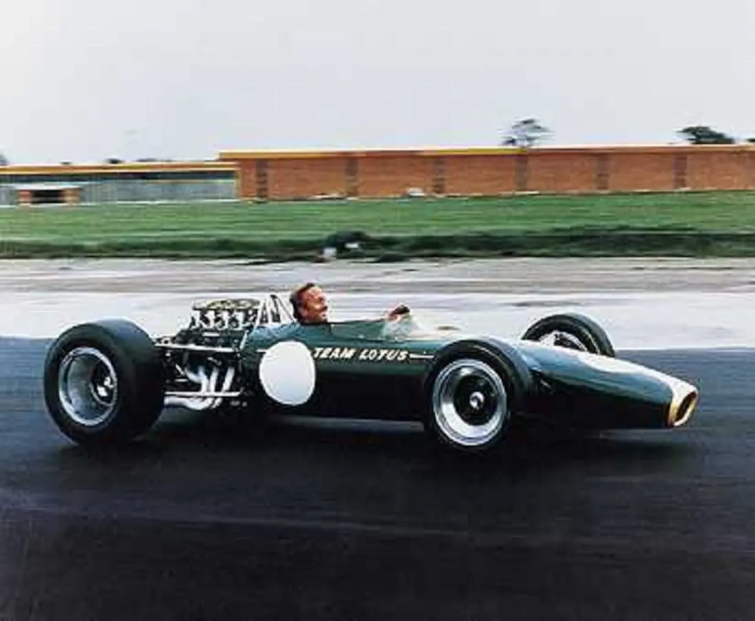 Colin Chapman at the Wheel of a Lotus 49