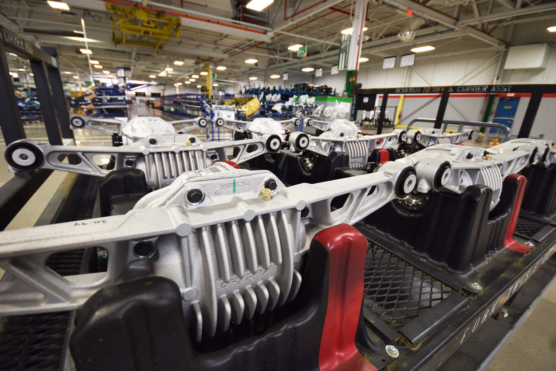 Diffs arrive from a supplier on a trolley. Workers retrieve the differentials they need for the Vipers they’re building in a given day’s shift. The differentials in the front of the trolley have cooling fins cast into their housing, to deal with the extra heat generated by racing use. They’re used in the track-focused Dodge Viper ACR. At the back of the trolley, standard Dodge Viper differentials are lined up. The standard rear differential has no cooling fins.