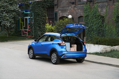 Editorial kicks wide 3 4 trunk doors open luggage 00402
