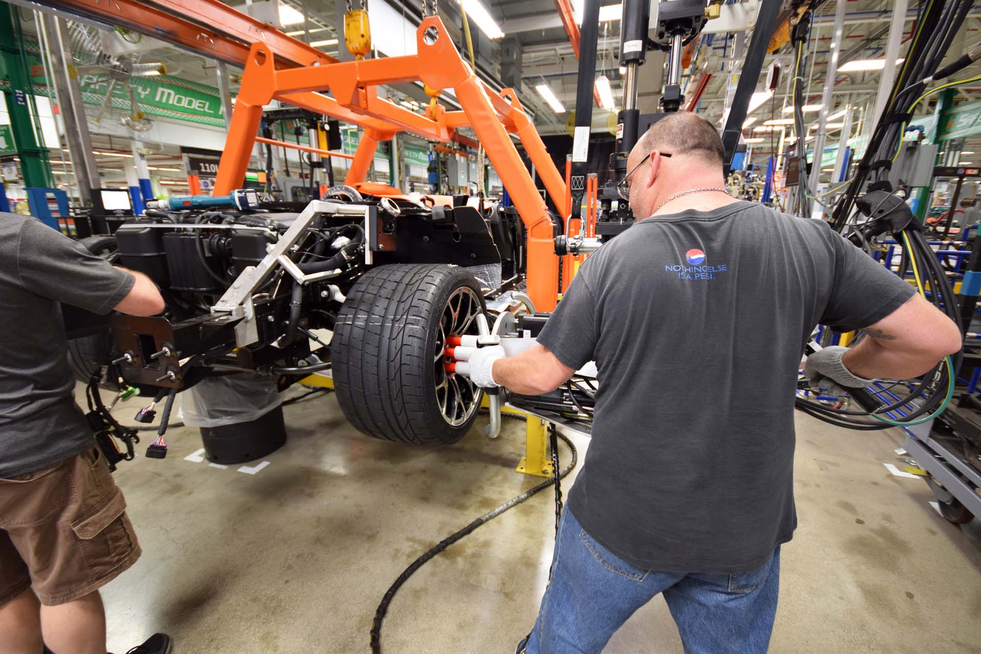 With the brakes installed, this worker uses a special tool called a “multi” to fasten all six lug nuts down, precisely and simultaneously for a perfect fit. Later, he’ll ensure the tires are inflated to the proper specifications before the car moves to its next station.
