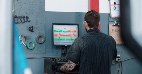 Editorial mechanic checking tire alignment 17 kal tire